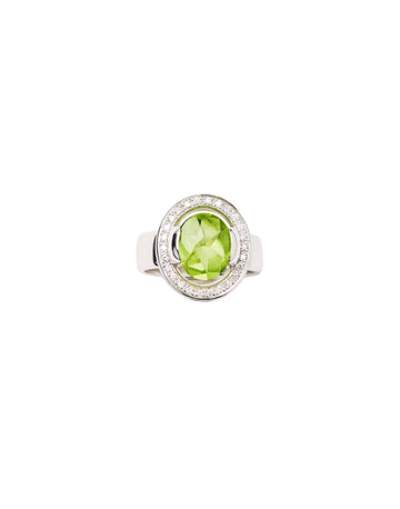 White gold ring with diamonds and peridot